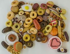 A collection of ceramic cakes, cookies, donuts, etc.