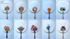 Miniature paintings of animals and flora on white hand fans. 