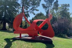 Mark di Suvero's Mamma Mobius, a large red metal sculpture on the lawn outside the San Luis Obispo Museum of Art.