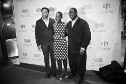 Black and white photo of Chiwetel Ejiiofor, Lupita Nyong'o, and Steve McQueen side by side.