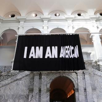 Stephanie Syjuco (U.S.A., b. 1974), I Am An . . ., 2017. Cotton fabric mounted on ceiling rack. © Stephanie Syjuco. Modern and Contemporary Art Fund, 2019.49. Installation view at the Cantor Arts Center. Photograph by Johnna Arnold.